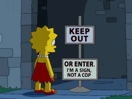 Lisa Simpson reads a sign that says 'Keep out. Or dont. I'm a sign, not a cop'